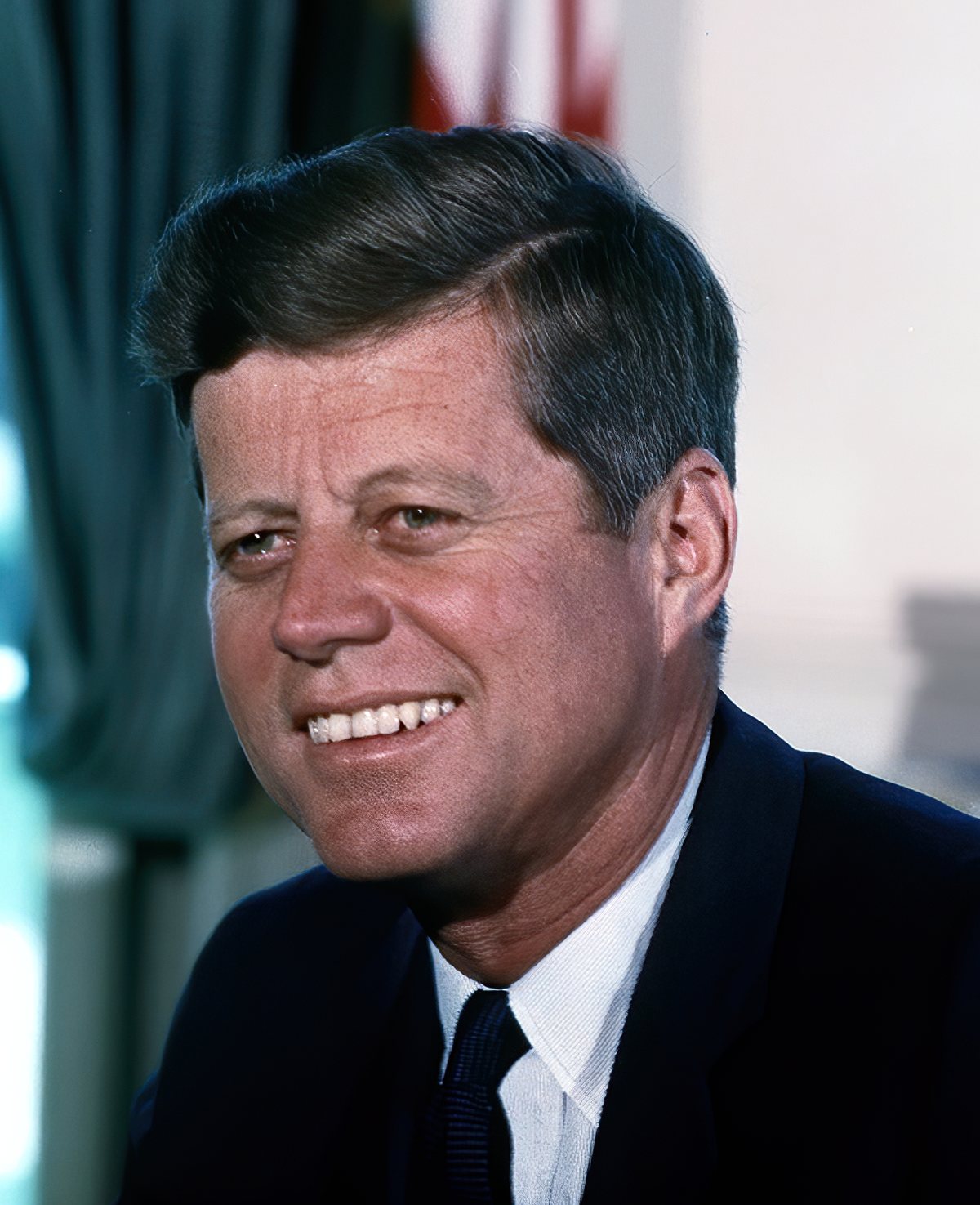 Color portrait of President John F. Kennedy in the Oval Office, photographed by Cecil Stoughton on July 11, 1963.