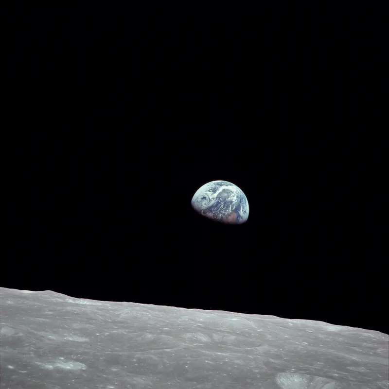 Earthrise. Apollo 8 astronaut Bill Anders photographs the Earth rising over the Moon, the first time people saw home from another world.