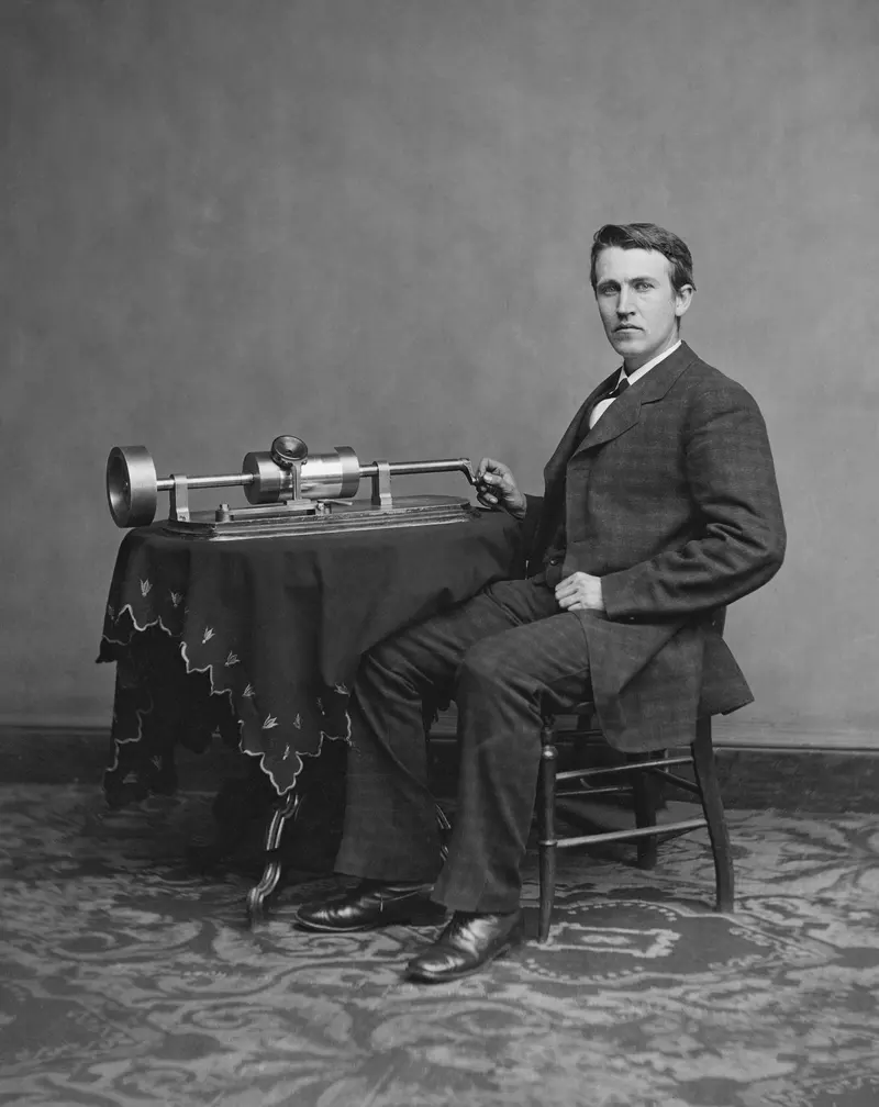 Edison and the Phonograph. Thomas Edison with his phonograph, the first machine that could record and play back the human voice.