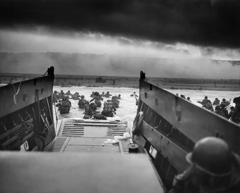 Into the Jaws of Death. Soldiers wade toward Omaha Beach on D-Day; pairs with Eisenhower's Order of the Day ("The eyes of the world are upon you").