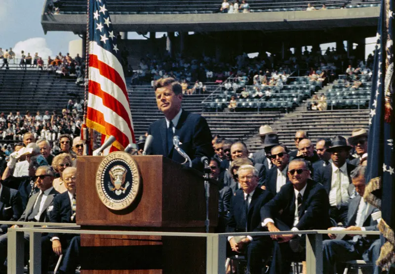 We Choose to Go to the Moon. JFK at Rice Stadium in Houston commits America to the Moon "not because they are easy, but because they are hard."