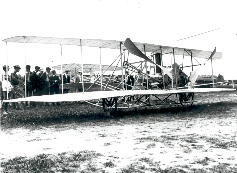 The Wright Flyer at Fort Myer. Orville Wright flies for the U.S. Army at Fort Myer, Virginia, in the trials that produced the world's first military airplane.