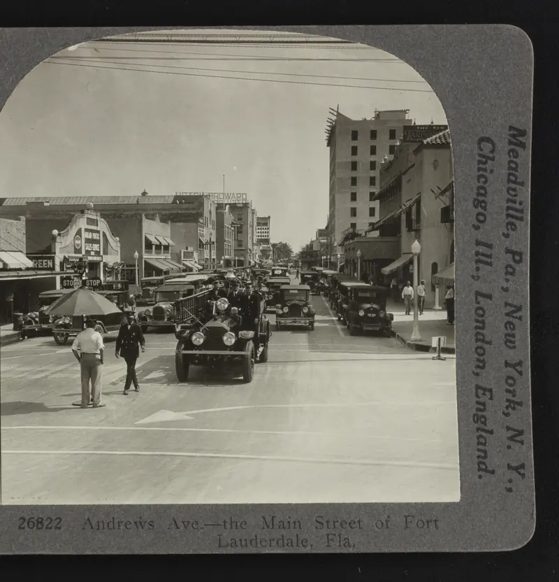 Andrews Avenue in Fort Lauderdale, about 1926, a wide street lined with buildings and early automobiles. Keystone View Company stereograph.