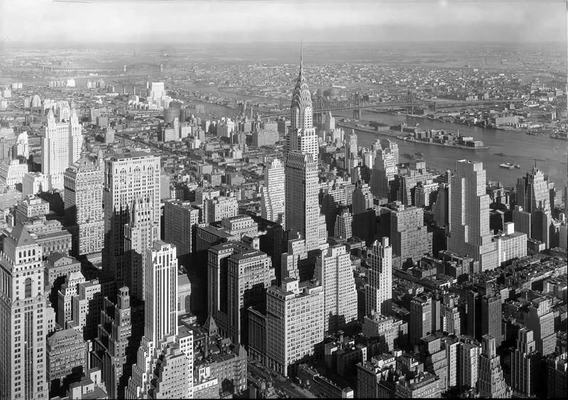 Chrysler Building, Midtown 1932. Its stainless-steel spire was assembled in secret inside the building and hoisted into place in about 90 minutes in 1929, briefly making it the tallest building on earth.