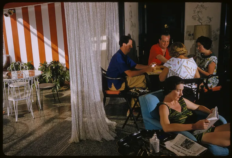 Lyford Cay Lunch, 1960 (Toni Frissell). Lunch under the striped awning at Lyford Cay, barely a year after it opened.