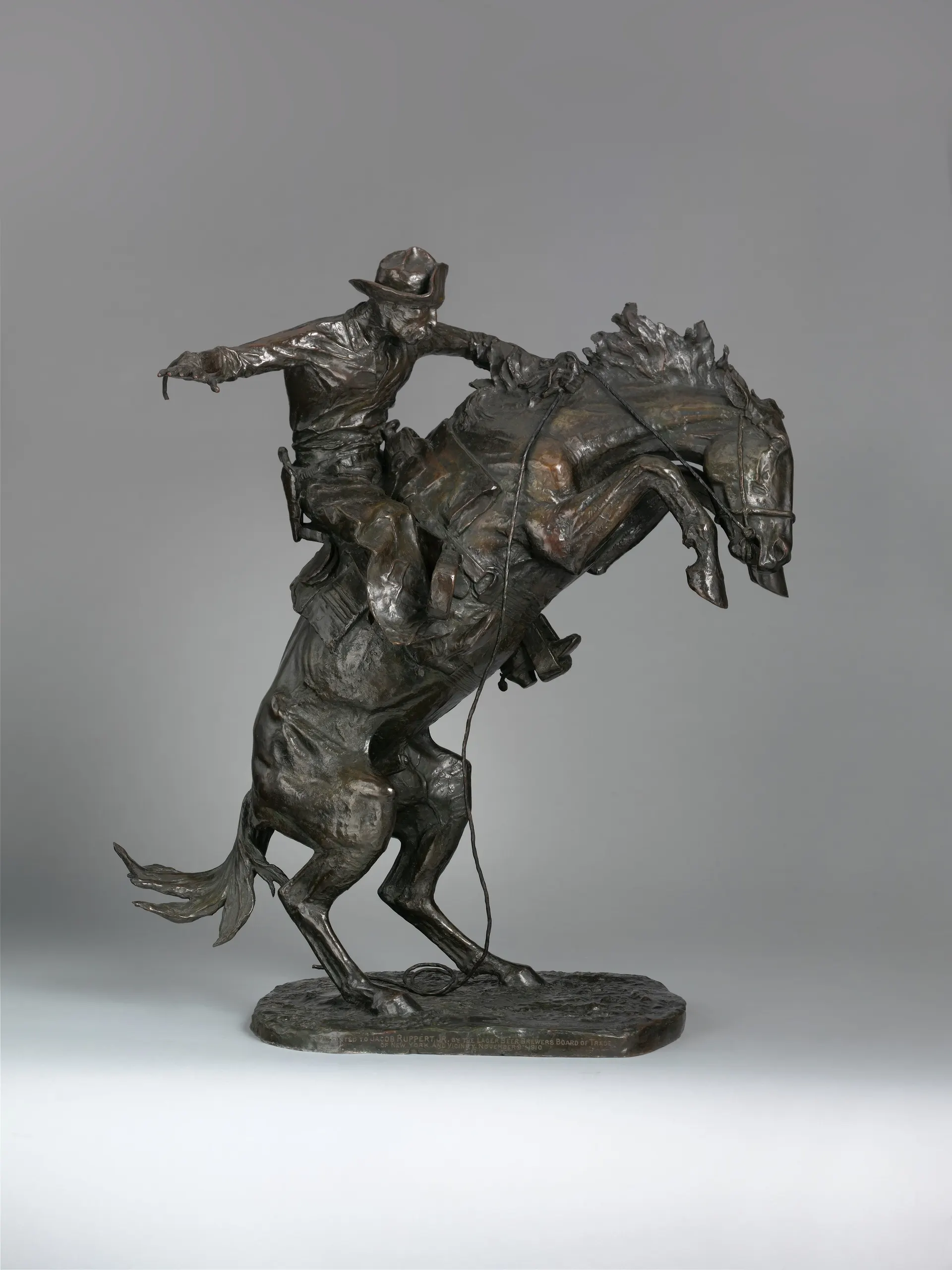 The Broncho Buster, Frederic Remington, modeled 1895. Remington's first sculpture balances a cowboy and a rearing bronc on just two hooves, and it became the most famous Western bronze ever made.